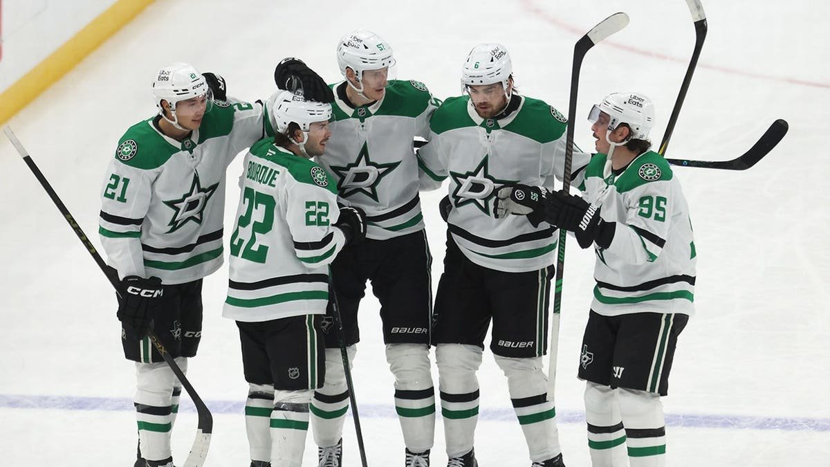 Dallas Stars center Mavrik Bourque celebrating with teammates on ice at PPG Paints Arena
