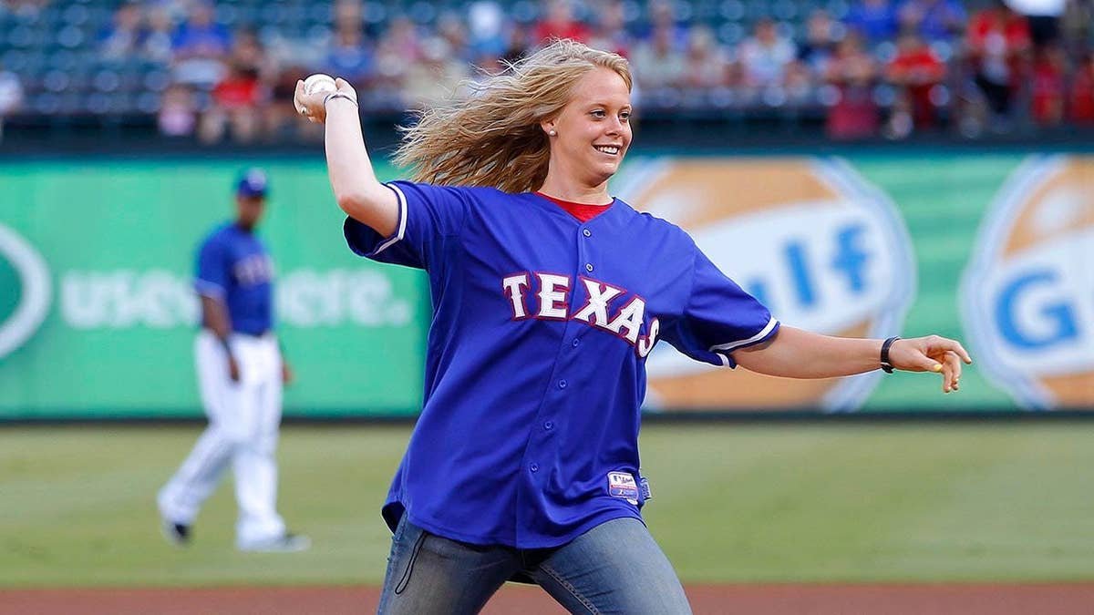 Melissa Jones of Baylor Bears throws honorary first pitch at Rangers Ballpark Arlington Texas