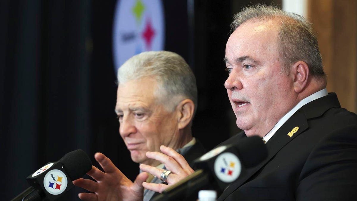Pittsburgh Steelers head coach Mike McCarthy speaking at a press conference with owner Art Rooney II listening