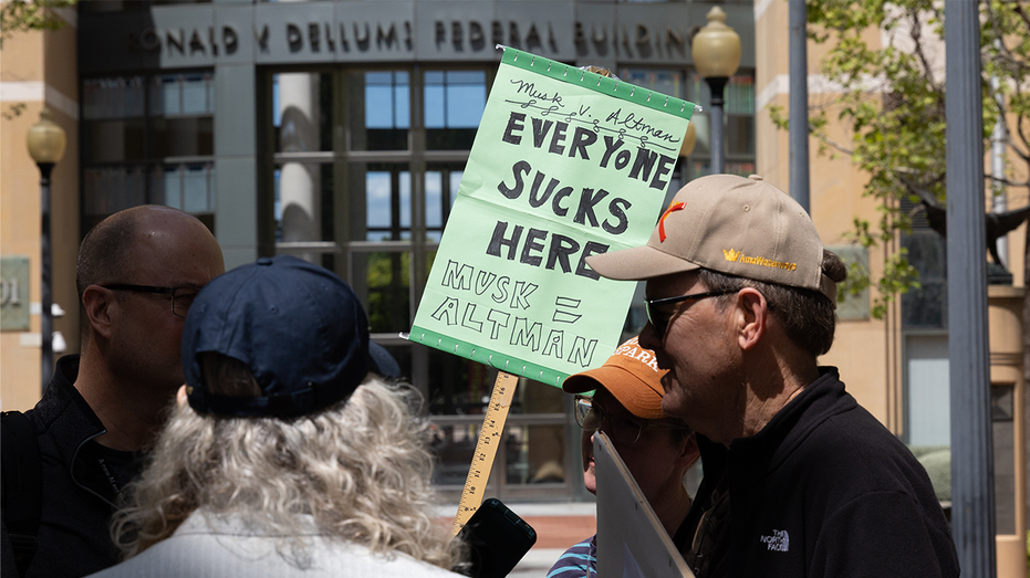 Demonstrators protest outside the courthouse