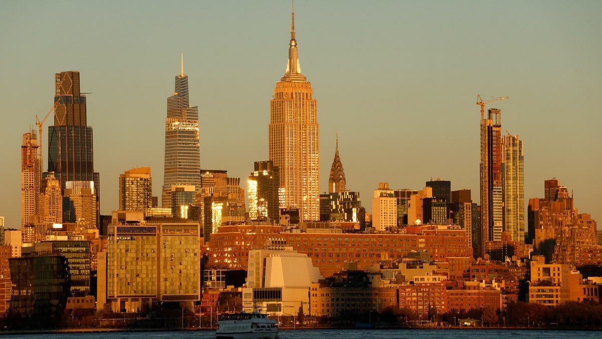 The Empire State Building and midtown Manhattan skyline at sunset in New York City
