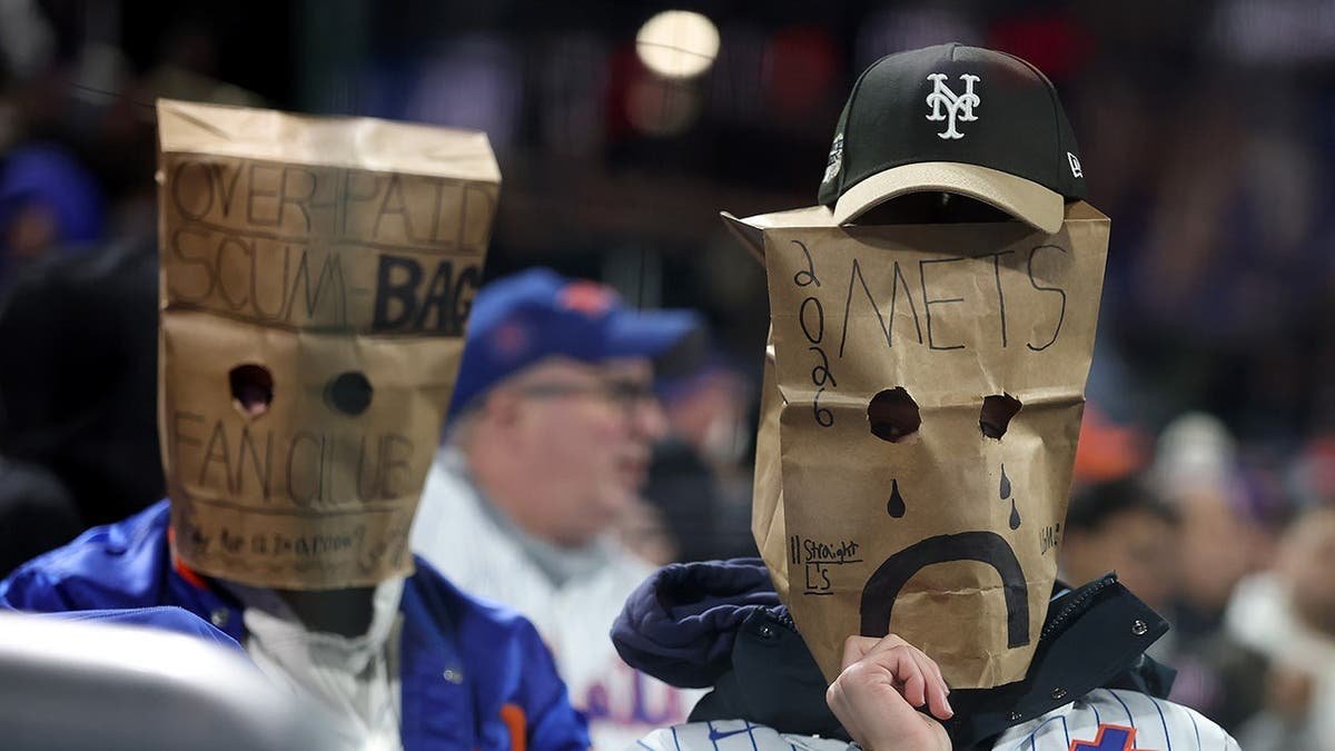 A New York Mets fan expressing frustration at Citi Field during a game.
