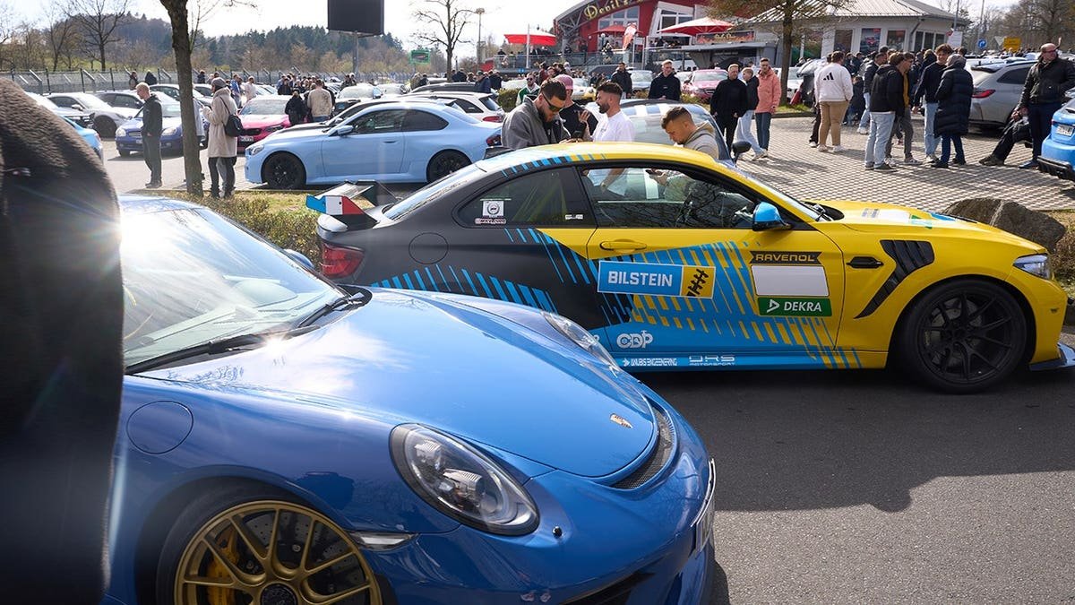 Car fans gathered at Nürburgring Nordschleife access road in Rhineland-Palatinate