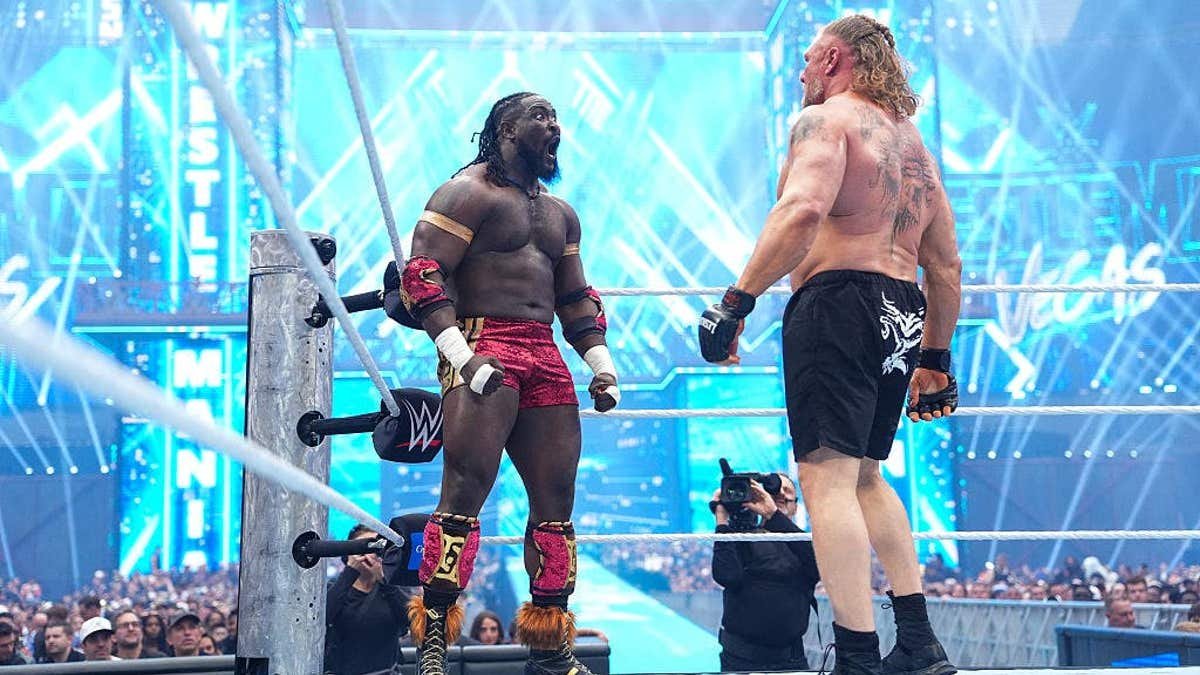 Oba Femi and Brock Lesnar face off in a wrestling ring at Allegiant Stadium