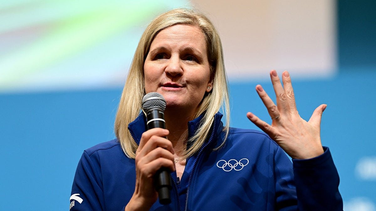 IOC President Kirsty Coventry speaking to volunteers in Milan