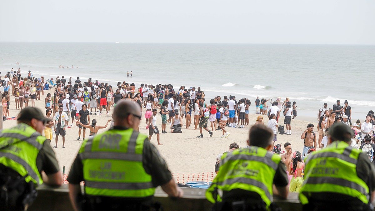 Law enforcement officers keep a watchful eye during Orange Crush