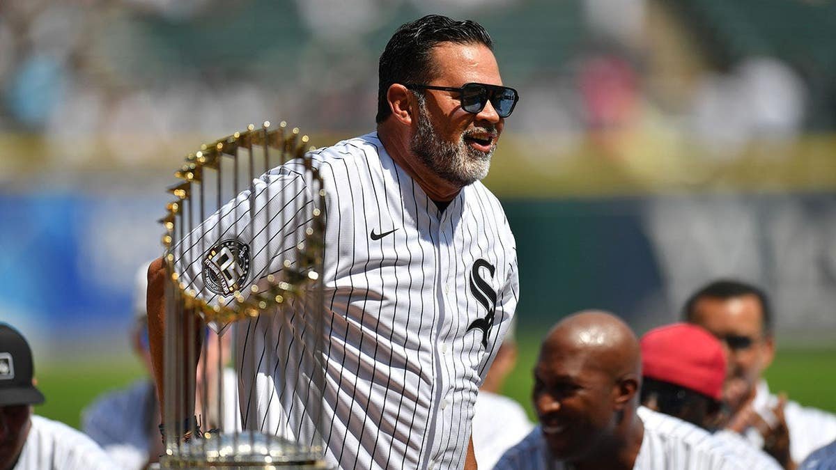 Former manager Ozzie Guillen standing on the field at Rate Field