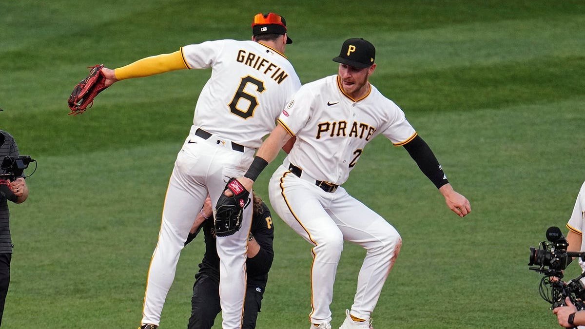 Pittsburgh Pirates' Ryan O'Hearn celebrating with Konnor Griffin after a baseball game