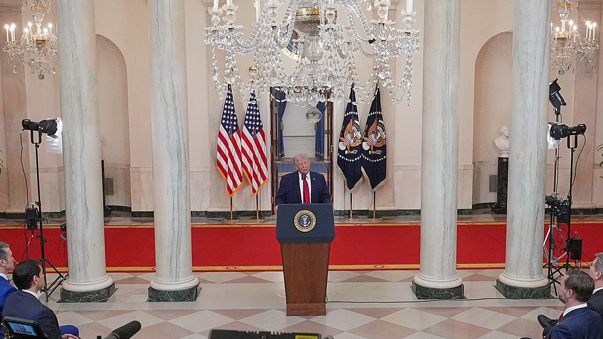 President Donald Trump speaking in the Cross Hall of the White House
