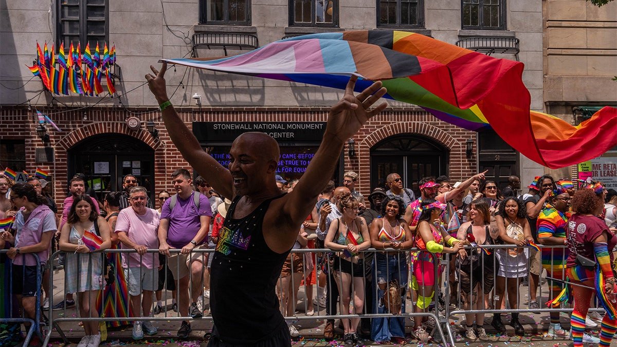 Crowds watching outside Stonewall National Monument during NYC Pride March