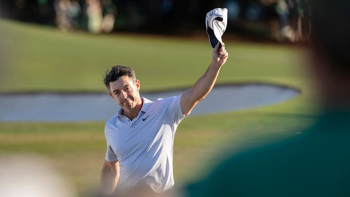 Rory McIlroy acknowledges patrons on the 18th hole at Augusta National Golf Club