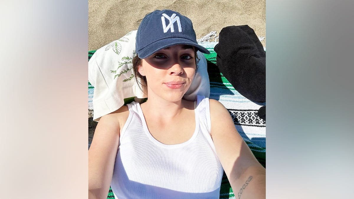 Samantha Emge posing and smiling in a portrait photograph