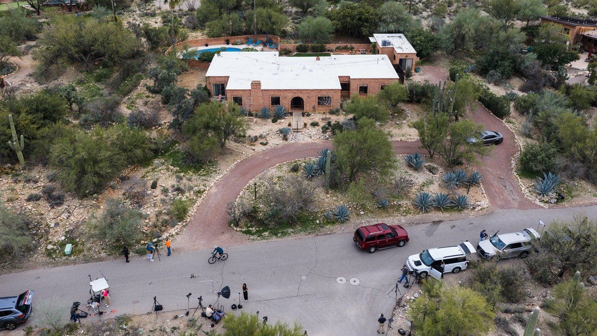 Members of the press working outside Nancy Guthrie's home in Tucson, Arizona