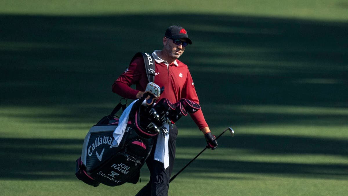 Sergio Garcia carrying his golf bag walking off the fairway at Augusta National Golf Club