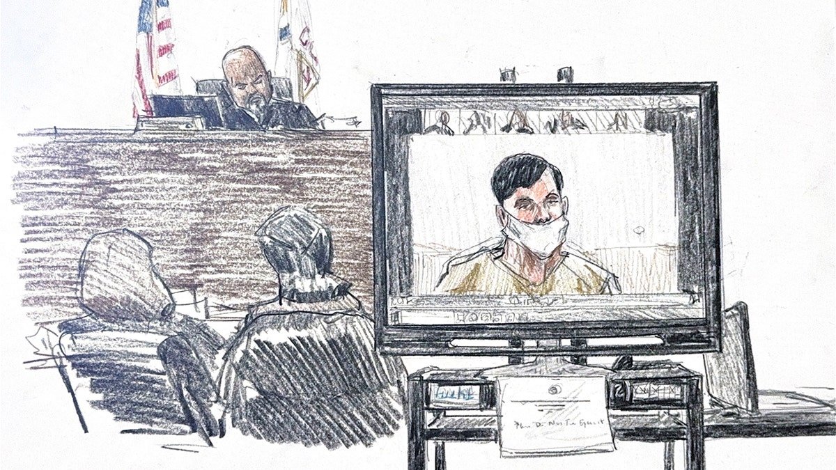 Jose Medina-Medina sitting at a table in a courtroom during a hearing