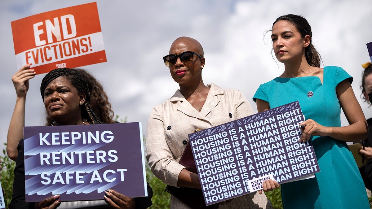 Rep. Cori Bush, Rep. Ayanna Pressley, and Rep. Alexandria Ocasio-Cortez speaking at a news conference on Capitol Hill