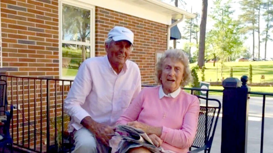 The Thackers outside a home.