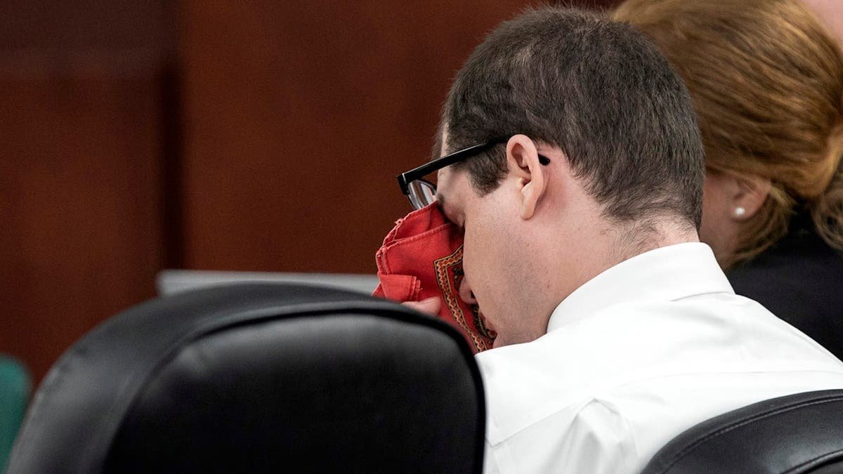 Tim Jones wiping his eyes during trial testimony in Lexington, South Carolina.