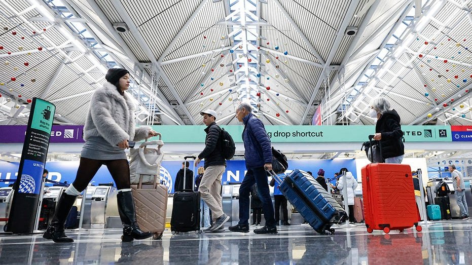 Travelers walking through O'Hare