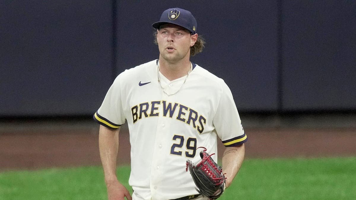 Milwaukee Brewers pitcher Trevor Megill reacting on the mound during a game.