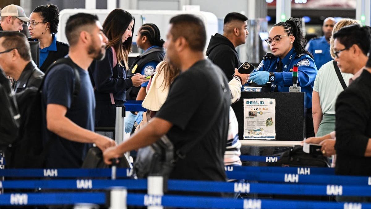 TSA agent works at Houston airport security checkpoint