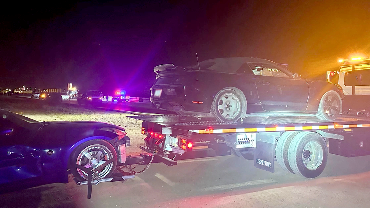 Sports car loaded onto flatbed tow truck with police lights after Tucson street takeover bust