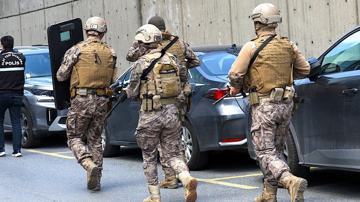 Turkish Police special forces walking near the Israeli consulate building in Istanbul