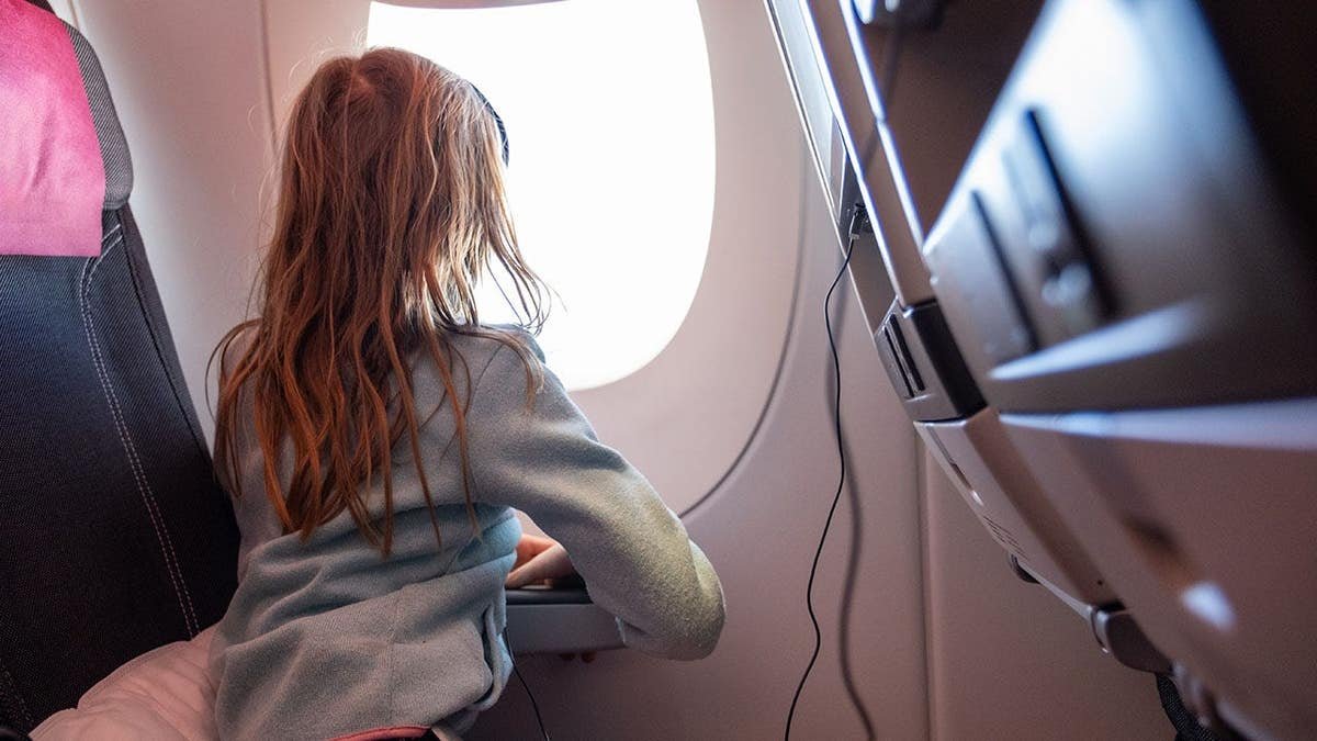Unsupervised child on plane