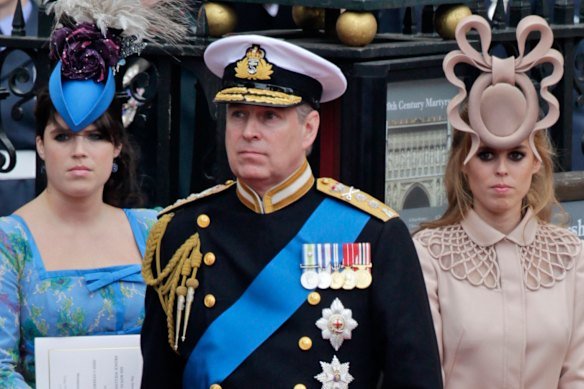 Andrew and his daughters, Princess Eugenie (left) and Princess Beatrice leave Westminster Abbey after the wedding of Prince William to Catherine Middleton in London in 2011.