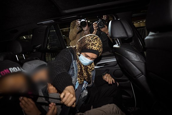 Islamic State-linked woman Kirsty Rosse-Emile gets into a car after arriving at Melbourne Airport this evening.