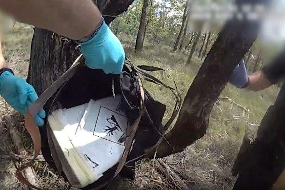 Footage from a raid shows a bucket containing a white substance.
