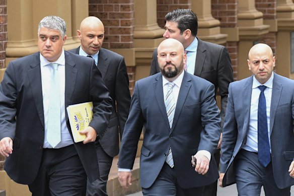 Solicitor Nick di Girolamo (left), with Moses Obeid (second from left), Eddie Junior (centre) and Paul Obeid (right) in 2016.