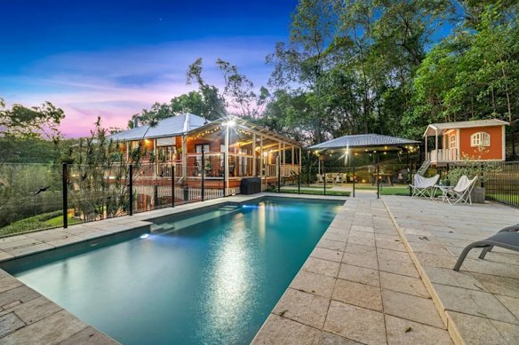 Gordon Wilkie has been ordered to remove part of the tiled pool terrace, the patio area and a large cubby house on his Brookfield property.