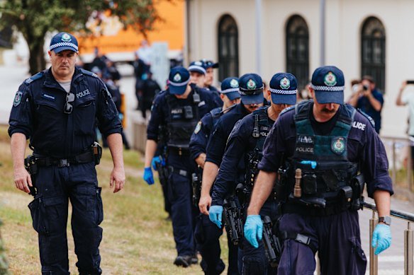 Police scour the crime scene at Bondi following the shooting.