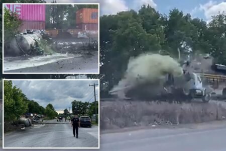 Horror as train collides with truck carrying septic tank, seriously injuring driver: video Horror as train collides with truck carrying septic tank, seriously injuring driver: video
