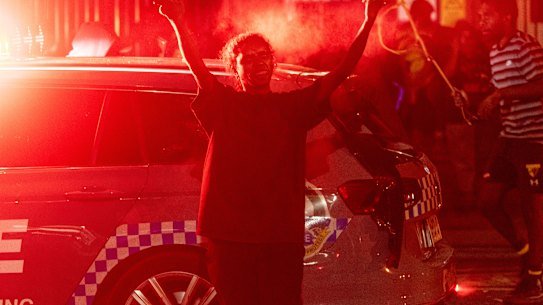 Community members protest outside Alice Springs Hospital.