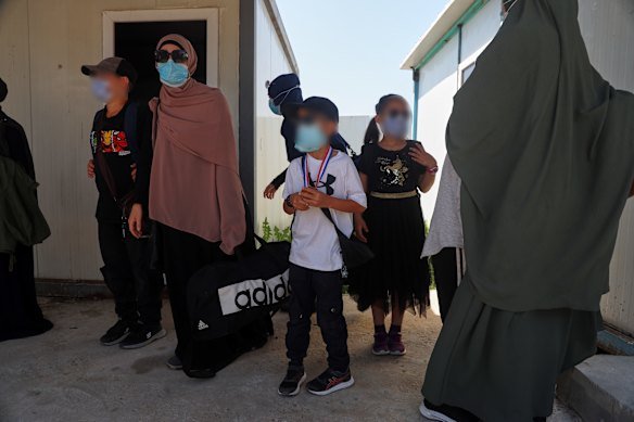 Members of Australian families at al-Roj camp in eastern Syria prepare to leave for Damascus as part of a second repatriation effort.