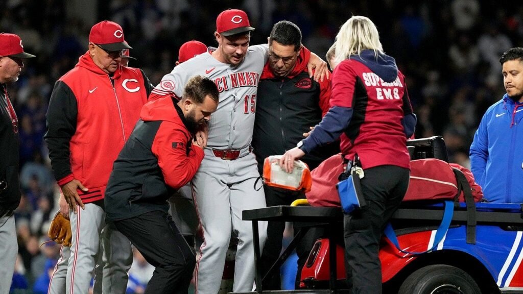 Reds closer carted off field after sustaining leg injury just one pitch into appearance