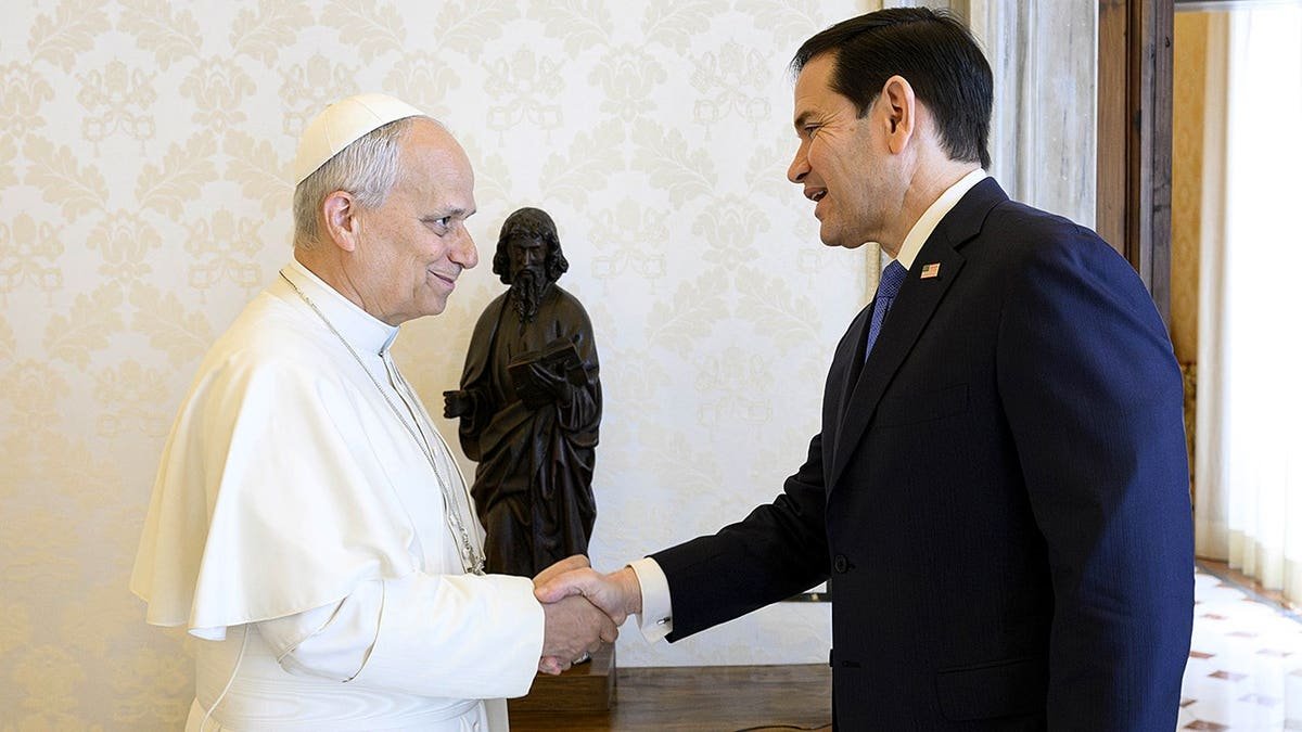 Pope Leo XIV and Marco Rubio shake hands