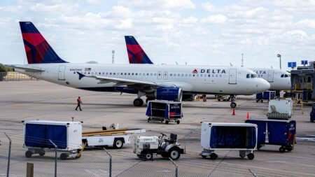 Delta worker dead after tug vehicle crashes into jet bridge at Orlando International Airport