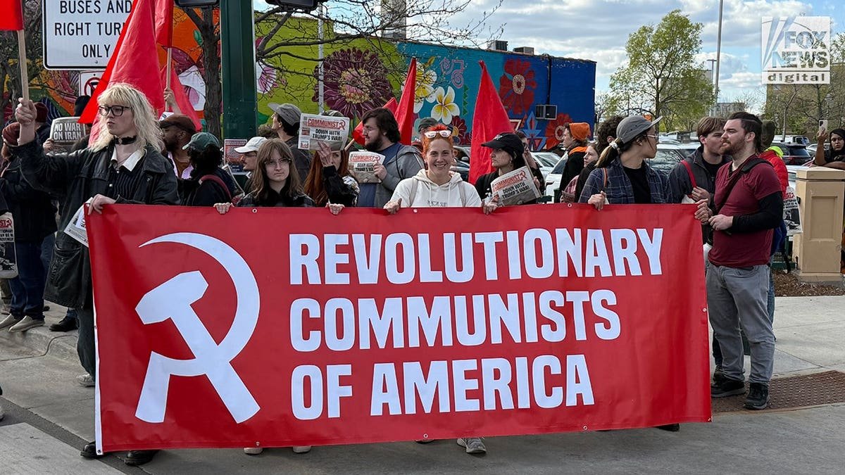 Revolutionary Communists of America banner carried by protesters at Minneapolis May Day rally