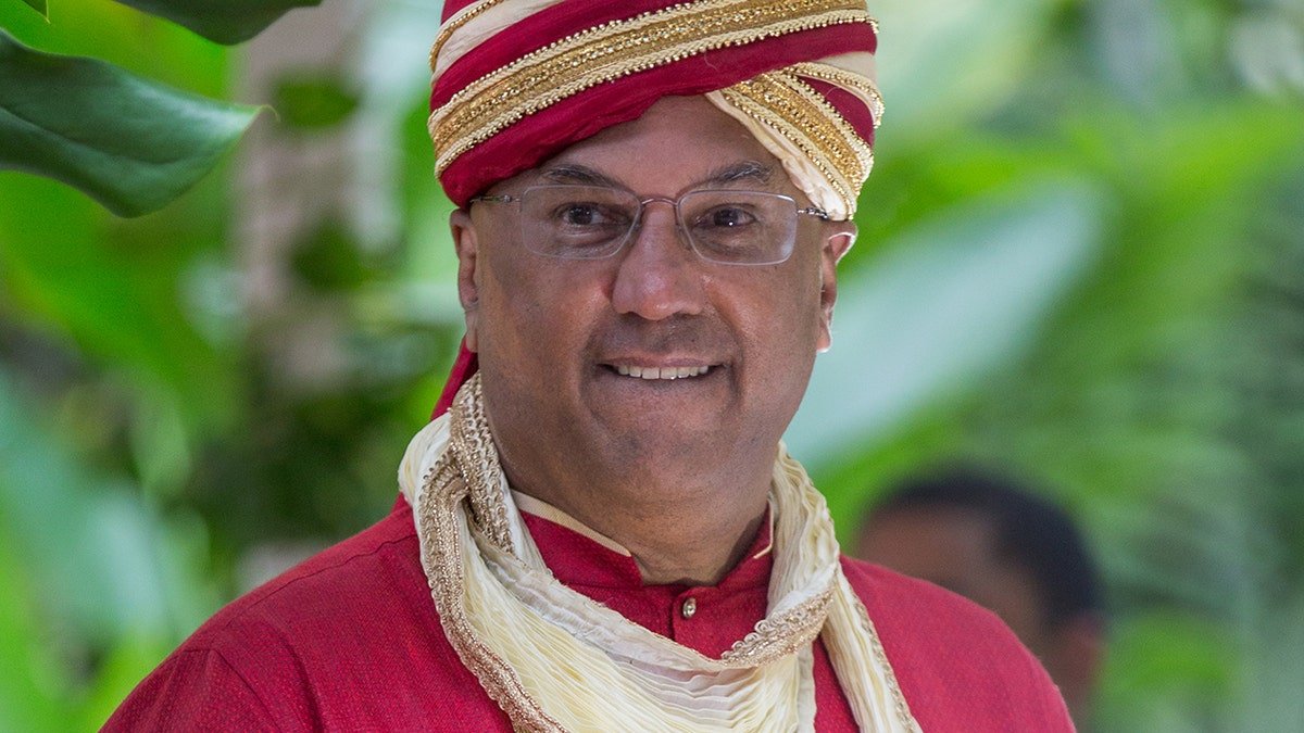 Neville Roy Singham smiling at his wedding to Jodie Evans in Ocho Rios Jamaica