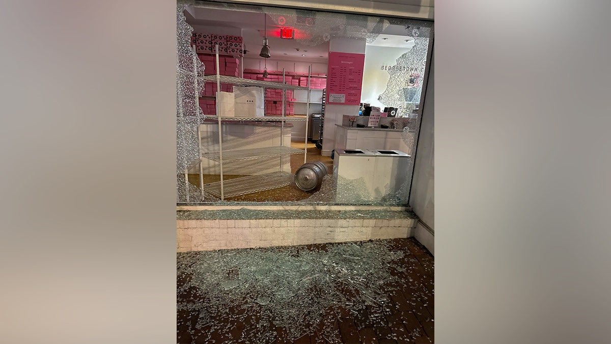 Georgetown Cupcake storefront with shattered front window and visible damage