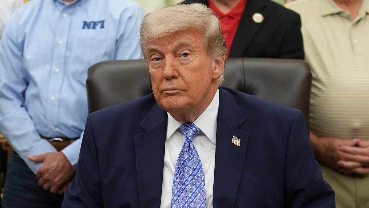 President Donald Trump sitting in the Oval Office at the White House