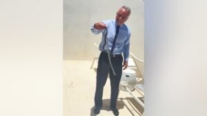 RFK Jr barehands a pair of snakes on Dr Oz’s patio in wild video RFK Jr barehands a pair of snakes on Dr Oz’s patio in wild video