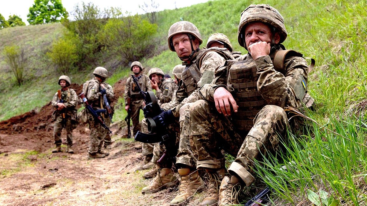 Newly recruited soldiers of Ukraine's 159th Separate Mechanized Brigade training at a military ground