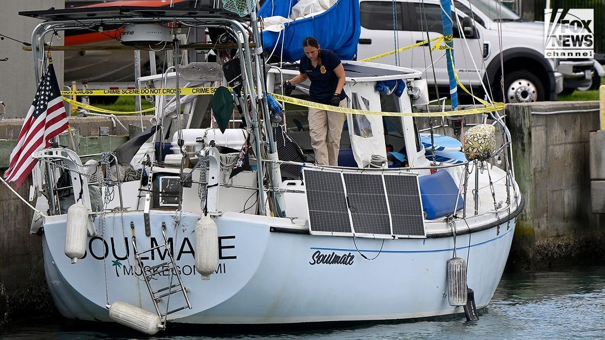 U.S. Coast Guard investigators search Brian Hooker's and his missing wife Lynette Hooker's the boat Soulmate.