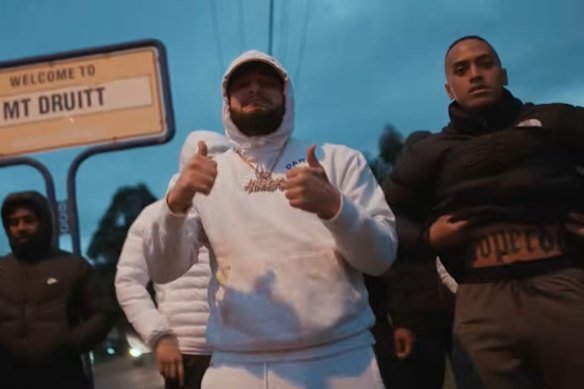 Lorenzo Lemalu (right) in a music video with rapper Ay Huncho, whose legal name is Ali Younes.