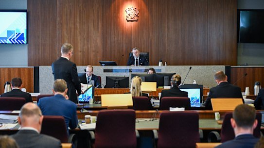 Commissioner Stuart Wood listens to senior counsel assisting, Patrick Wheelahan, during hearings in February.