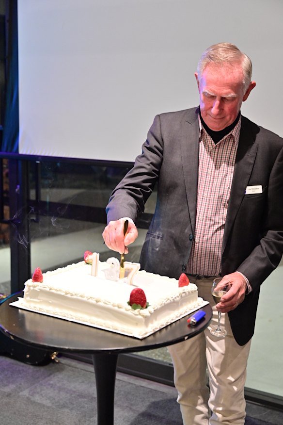 Mayor Sheather cutting the launch party cake in July 2025.